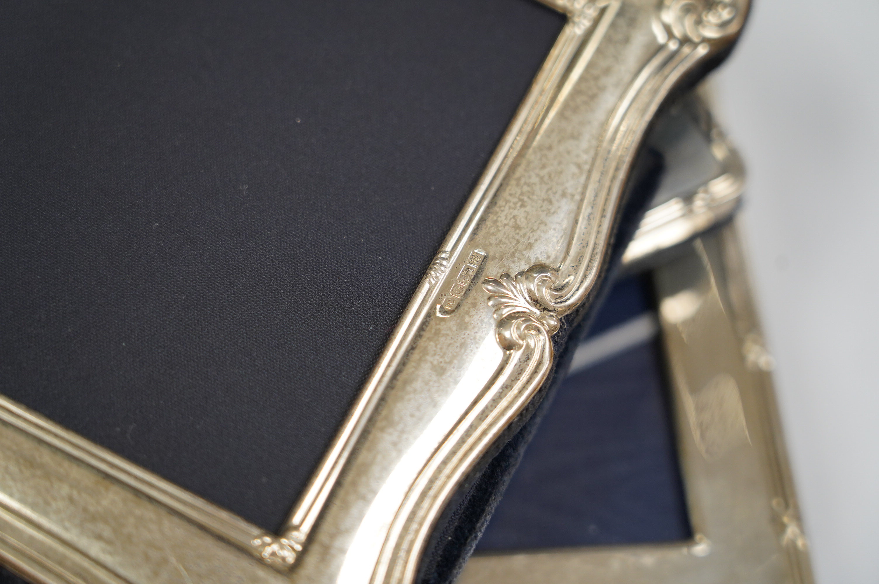 Four assorted silver mounted photograph frames including a double, largest 21.3cm. Condition - fair to good